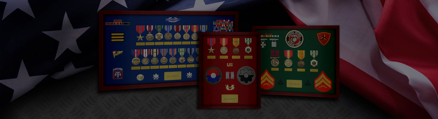 Military medals and badges displayed in frames with American flag background.