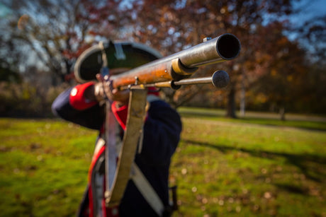 A reenactor participates in a battle to show when was the Army established.