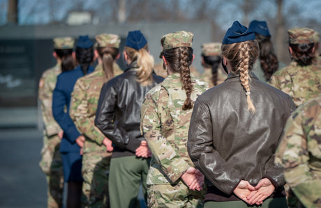 Female Airmen stand in formation.