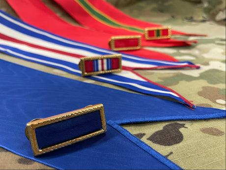 Unit citation ribbons and flag streamers await presentation.