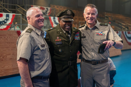 Army officers pose for a picture wearing the AGSU.