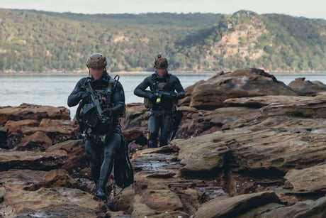 SEAL team members come ashore during training.