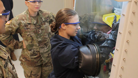 Military researchers work in a lab.