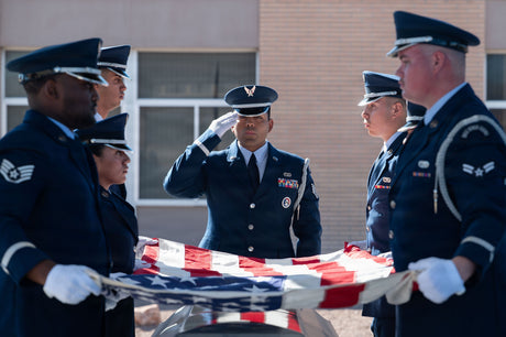 Funeral services are conducted for a fallen airman.