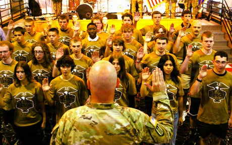 An Army officer issues the oath of enlistment to recruits.