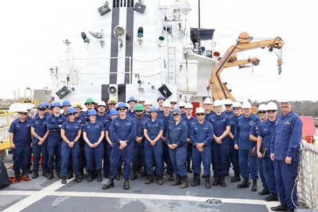 USCG members gather for a photo.