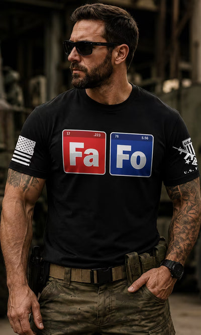 Badass Basics - man in a black tee with a red and blue chest graphic, standing in front of a military truck.
