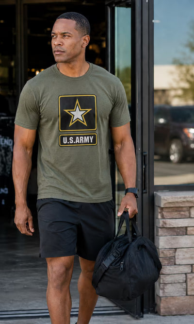 Licensed Apparel - man in an olive U.S. Army logo tee carrying a duffel bag.